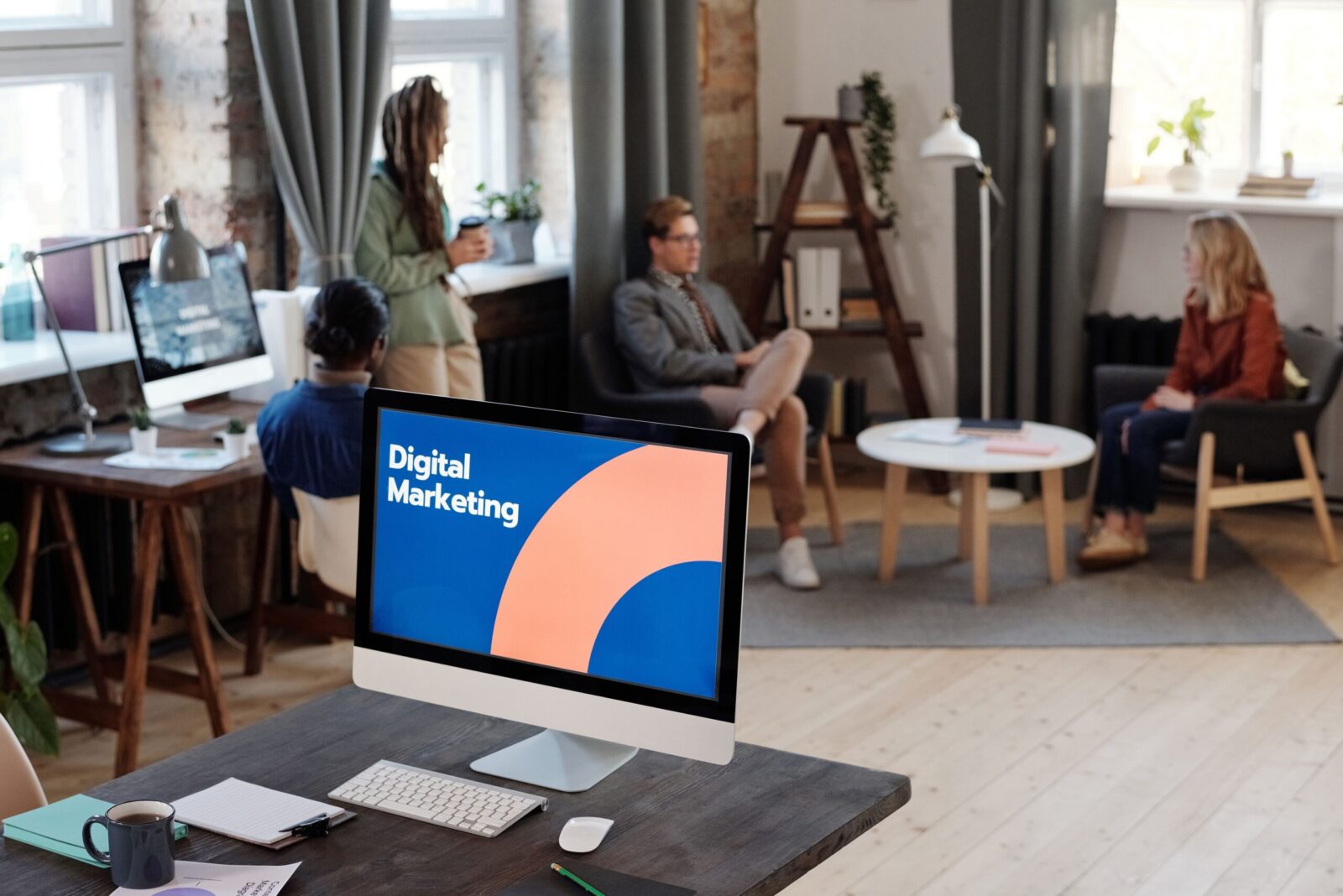 AI Is Now in Nearly Every Marketing Plan - So Why Is "Data Quality" Still the Bottleneck? 3 Collaborative team meeting in a modern office setting with digital marketing focus.